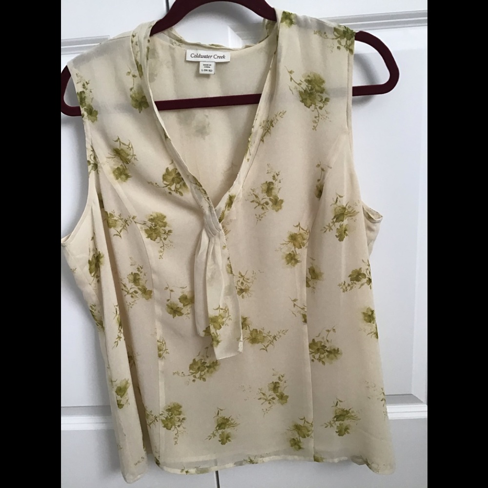 Sleeveless polyester blouse with front tie.